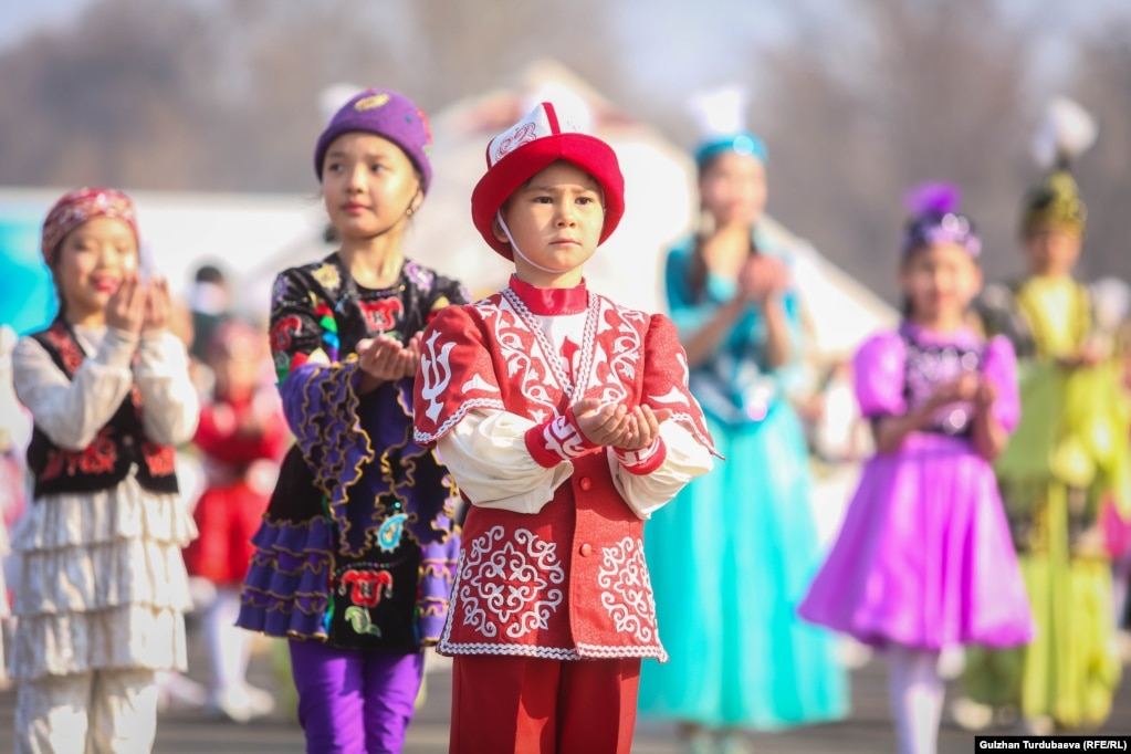 Young children wearing traditional costumes take part in celebrations at Ala-Too Square in Bishkek.