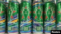 Cans of Heineken beer are displayed at a shop in Moscow.