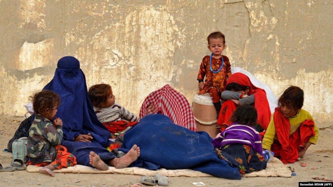 Afghan refugees rest upon their arrival from Pakistan at a registration center near the Afghan-Pakistani border in the Spin Boldak district of Kandahar Province on November 6. 