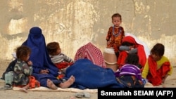 Afghan refugees rest upon their arrival from Pakistan at a registration center near the Afghan-Pakistani border in the Spin Boldak district of Kandahar Province on November 6.