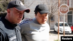 Do Kwon (right) was arrested in Montenegro in March last year. (file photo)