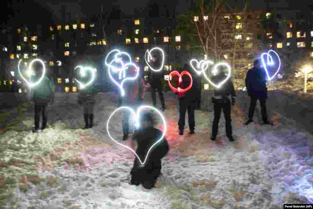 People draw hearts with their cell-phone flashlights in support of Navalny in Moscow in February 2021. Opposition leaders urged people to shine their flashlights in a sign of solidarity with Navalny as the country experienced several weekends of nationwide protests.