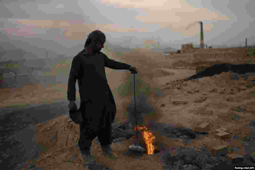 A man works in a brick factory in the outskirts of Kabul, Afghanistan.&nbsp;