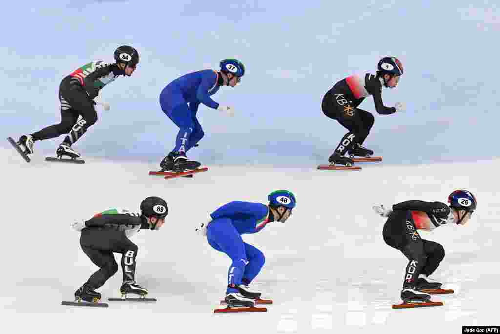 Skaters from Bulgaria (left), Italy, and South Korea compete during the semifinals of the mens 5,000-meter relay at the ISU World Cup Short Track Speed Skating event in Beijing.