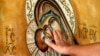 A Macedonian Orthodox believer touches an icon of the Virgin Mary. (file photo)