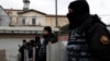 Turkish police stand guard outside the Italian Santa Maria Catholic Church after the shooting on January 28.