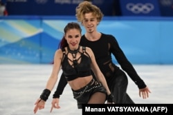 Diana Davis and Gleb Smolkin compete during the Beijing 2022 Winter Olympic Games in Beijing on February 12, 2022. Davis and Smolkin now represent Georgia instead of Russia.