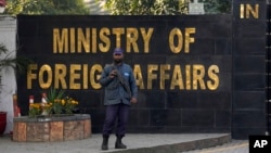 A police officer stands guard at the main entry gate of Pakistan's Ministry of Foreign Affairs in Islamabad. 