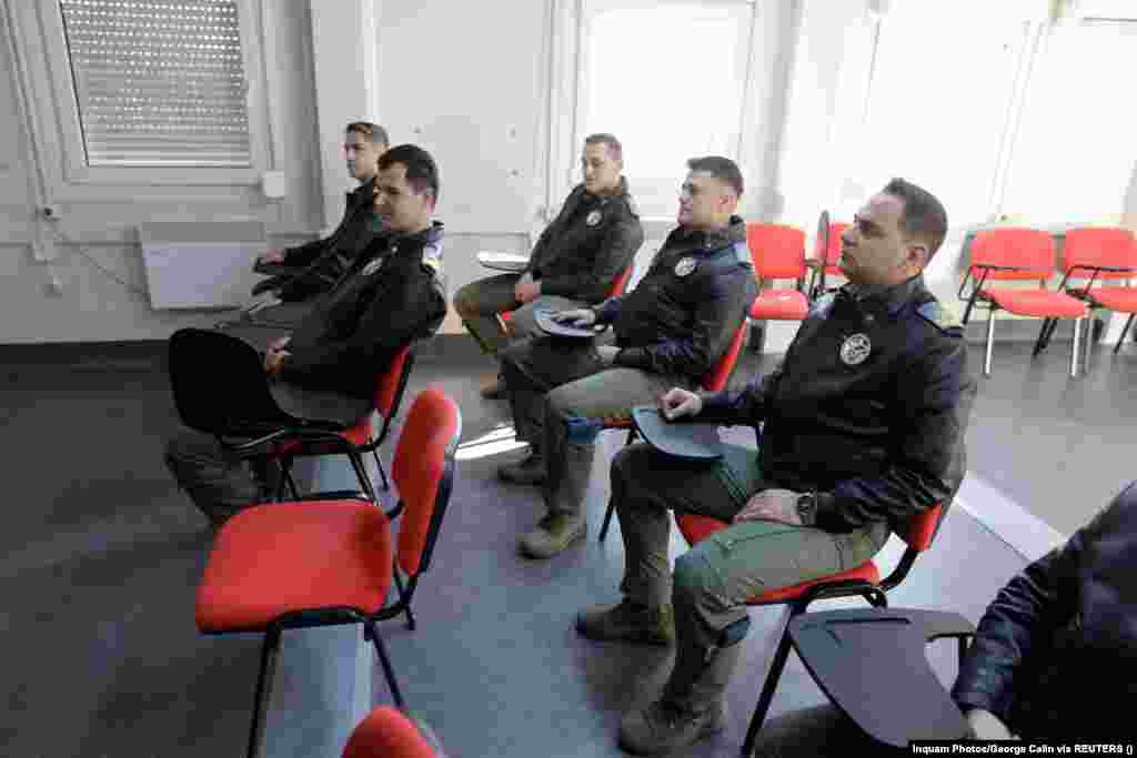 Romanian Air Force pilots sit inside a training room. Seven pilots began their training at the center on November 13. Ollongren said European allies had to keep supporting Ukraine and they could not &quot;afford any fatigue&quot; regarding the war. &quot;We must increase our efforts, we must continue our support to Ukraine in every possible way,&quot; she said.