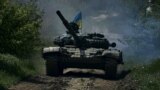 UKRAINE – A Ukrainian tank rides near Bakhmut, an eastern city where fierce battles against Russian forces have been taking place, in the Donetsk region, May 12, 2023