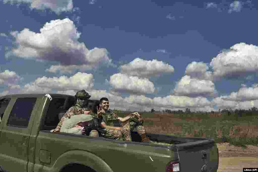 Ukrainian soldiers ride in a pickup truck near Bakhmut on September 3. The Institute for the Study of War&nbsp;said on September 3 that recent geolocated footage shows Ukrainian troops have entered the village of Klishchiyivka, around 7 kilometers south of Bakhmut.