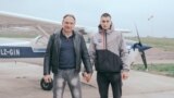 Bulgaria -- Father and Son portraits of men holding hands by Valery Poshtarov