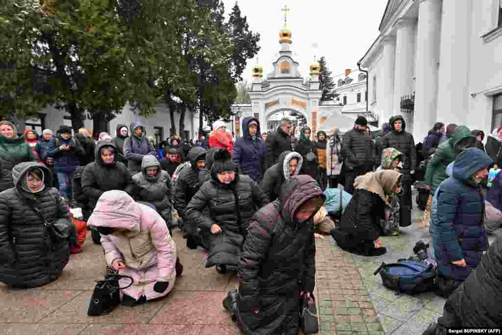 Ukrainian Orthodox Christians pray at the historic Kyiv-Pechersk Lavra church in Kyiv.