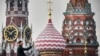 RUSSIA -- A man makes a selfie photo in front of the Kremlin's Spasskaya tower and St. Basil's cathedral in downtown Moscow on September 11, 2023