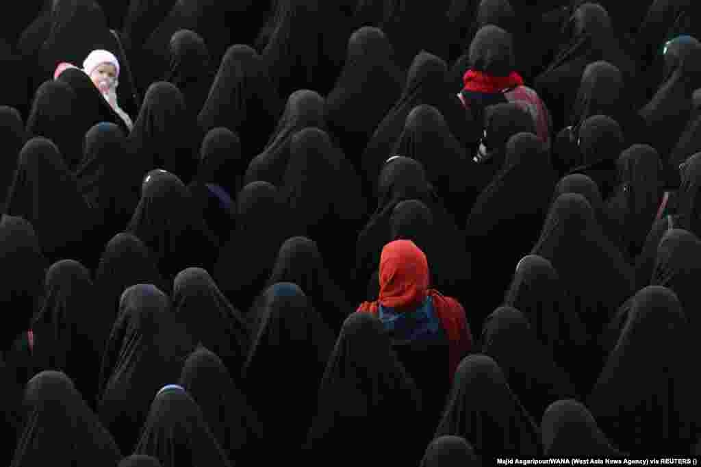 People gather for the funeral of Sadegh Omidzadeh and Mohammad-Amin Samadi, members of Iran&#39;s Islamic Revolutionary Guards Corps, in Tehran.