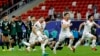 Tajikistan's players celebrate after the penalty shoot-out of the Qatar 2023 AFC Asian Cup football match between Tajikistan and U.A.E. at Ahmad Bin Ali Stadium in Al-Rayyan on January 28.