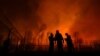 Firefighters battle a wildfire near the village of Bogorodinskoye in Russia&#39;s Vologda region on May 7.<br />
<br />
More than 4,800 firefighters and some 6,000 volunteers have been battling wildfires that have engulfed large areas of Russia&#39;s Ural Mountains and Siberia.