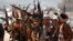 Reprezentanți ai mișcării Houthi în timpul unei adunări la sfârșitul unui antrenament militar, la periferia orașului Sana'a, Yemen, 22 ianuarie 2024 