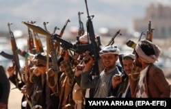 Newly recruited members of the Houthi rebels meet on the outskirts of the Yemeni capital, Sanaa, in 2024.