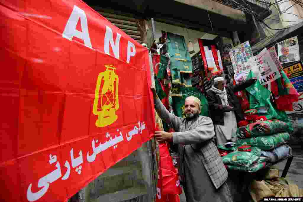 Vendors in Peshawar sell flags of the Awami National Party (ANP), whose symbol is a lantern