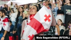 Georgian fans cheer on their country's team at the EURO 2024 football championship.