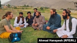 A German tourist talks to local residents and Taliban officials in the northern province of Panjshir.