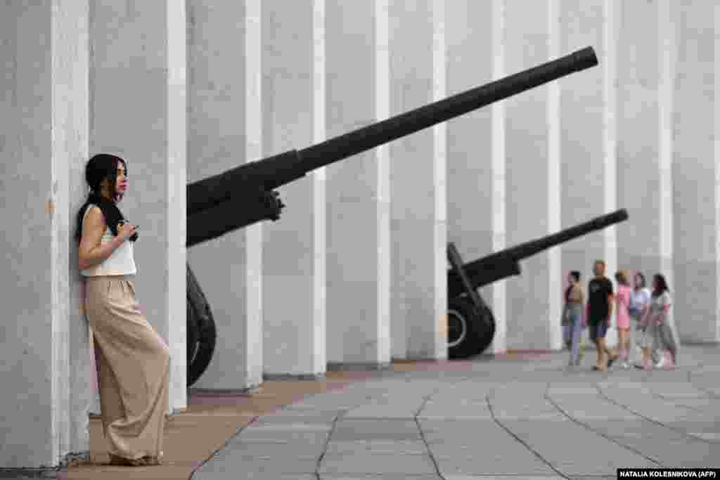 A woman leans against the colonnade of the Museum of the Great Patriotic War (also known as the Victory Museum), the largest museum of military history in Russia at Poklonnaya Hill in Moscow.&nbsp;