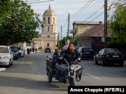 A Lipovan family returns from church in Jurilovca.