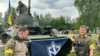 Члени військового підрозділу «Російського добровольчого корпусу» (РДК) біля броньованої машини, Бєлгородська область Росії, ілюстративне фото