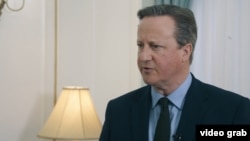 British Foreign Secretary David Cameron speaks with RFE/RL's Kyrgyz Service on April 22.