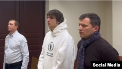 Vacio (center) appears in court in Moscow on December 22.
