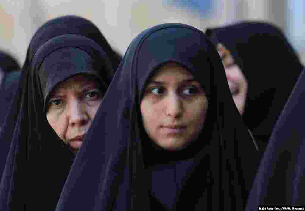 Iranian women wait in line to vote at a polling station in a snap presidential election in Tehran on June 28. Iranians will choose between mostly hard-line candidates to choose a successor to Ebrahim Raisi following his death in a helicopter crash.
