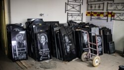 Gravestones are displayed at Volodymyr Cherdakov's workshop near Yatseve cemetery on the outskirts of Chernihiv in January.