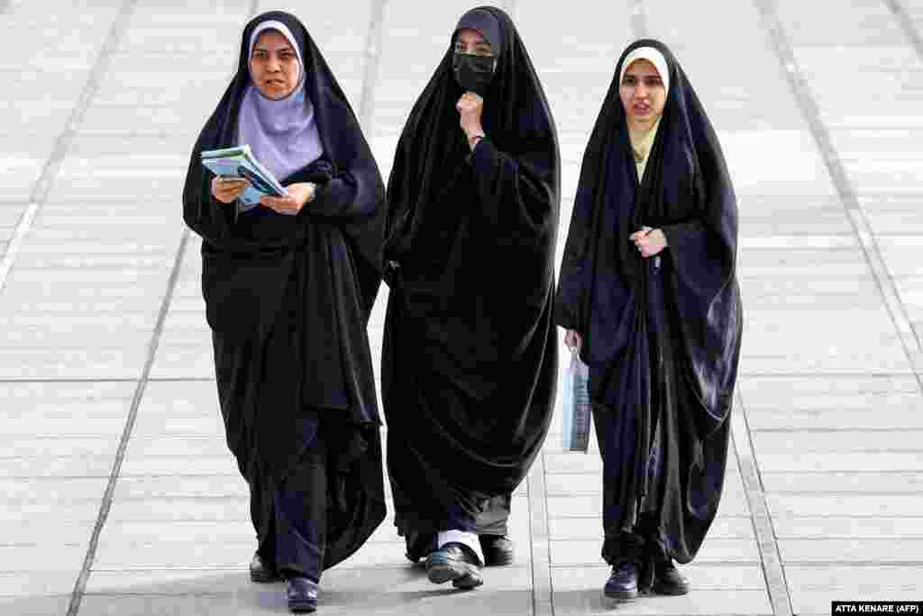 Women visit the 34th Tehran International Book Fair at the Imam Khomeini Mosque in Tehran.