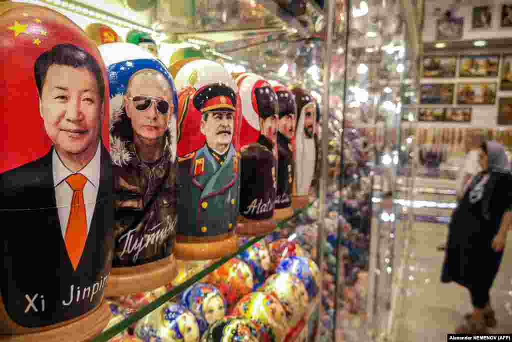 Traditional Russian wooden Matryoshka nesting dolls depict Chinese President Xi Jinping, Russian President Vladimir Putin, and Soviet leader Joseph Stalin at a souvenir shop in downtown Moscow.