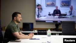 Ukrainian President Volodymyr Zelenskiy speaks with representatives of the British defense company BAE Systems via a video link earlier this year. 
