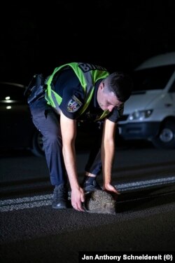 At night, stray dogs and cats, but sometimes hedgehogs, populate the empty streets on the outskirts of Kyiv.