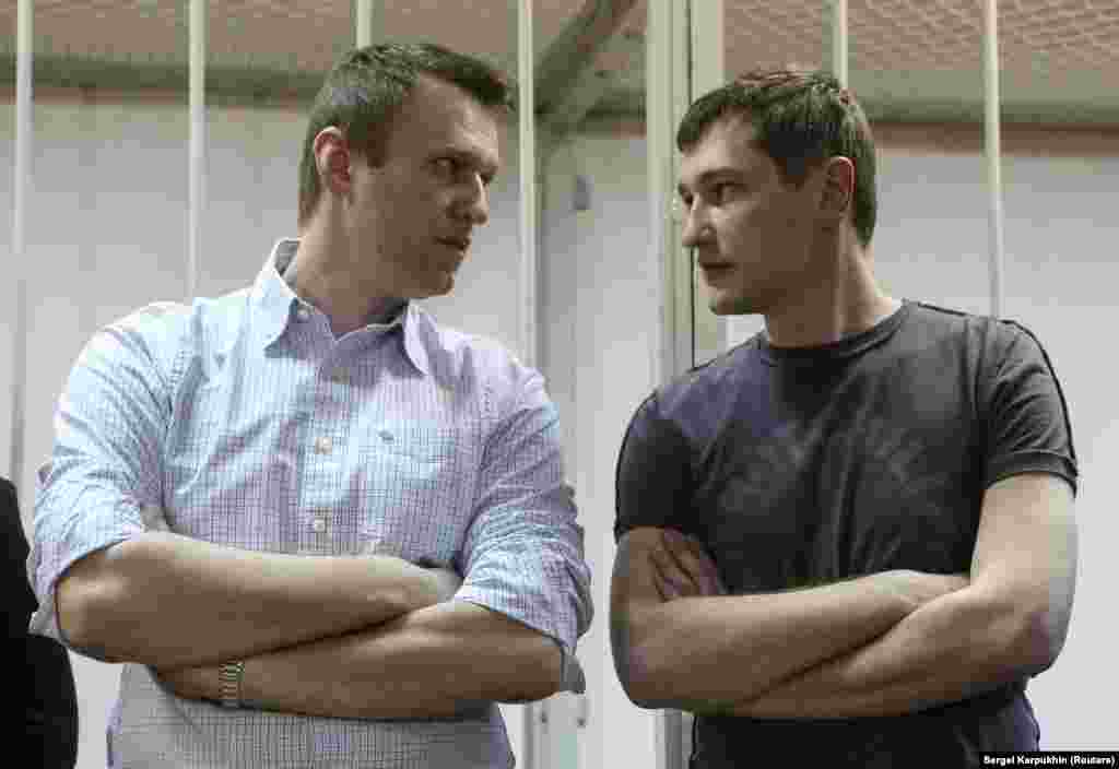 Navalny and his brother and co-defendant, Oleg, attend a court hearing in Moscow on December 30, 2014, in a separate embezzlement case. The court ruled that Navalny be given a suspended sentence but jailed Oleg for 3 1/2 years.&nbsp;