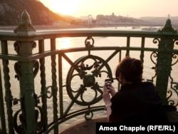 A tourist photographs the statuette of Franz Joseph on July 11.