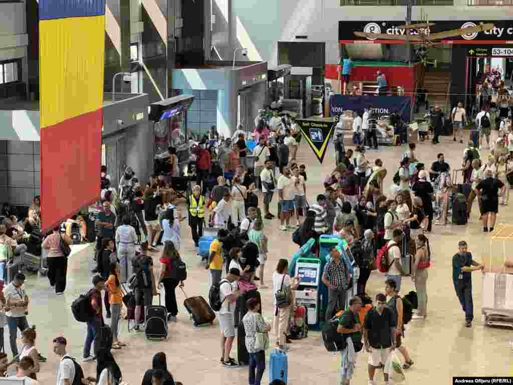 Passengers at Bucharest Henri Coanda International Airport await further information during the outage. &nbsp;