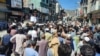 Pakistan Tehrik-e Insaf party supporters protest in Swat, northwestern Pakistan, after the arrest of Imran Khan on May 9.