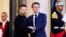 French President Emmanuel Macron (right) welcomes Ukrainian President Volodymyr Zelenskiy in Paris on May 14. Macron said on May 31 that Europe needed to "provide clear and tangible security guarantees" to Ukraine.