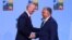 NATO Secretary-General Jens Stoltenberg (left) shakes hands with Hungarian Prime Minister Viktor Orban ahead of a NATO leaders summit in Vilnius in July 2023.
