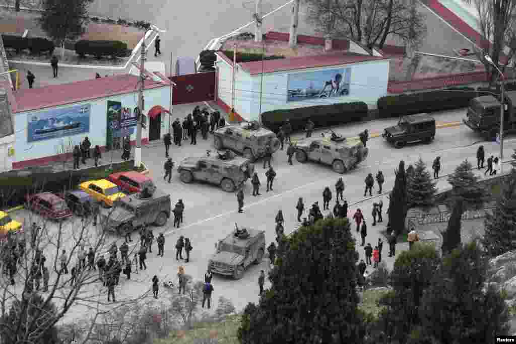 Unmarked Russian soldiers and vehicles surround a Crimean border-guard base in Balaclava on March 1. The same day, Crimea&rsquo;s pro-Russian prime minister appealed to the Kremlin to &quot;provide assistance in ensuring peace and tranquility&quot;&nbsp;in Crimea. &nbsp;