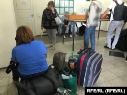 People waiting inside the Russian border facility on June 21.