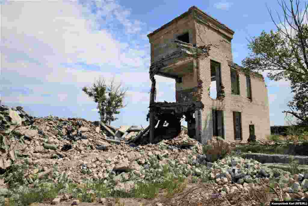 Ruins of the town of &quot;G&quot; stand near Degelen Mountain, what locals call the abandoned military town on the site. &nbsp; The locals took the buildings apart for construction materials that they could sell.&nbsp;Heavy machinery was used to destroy the town. 