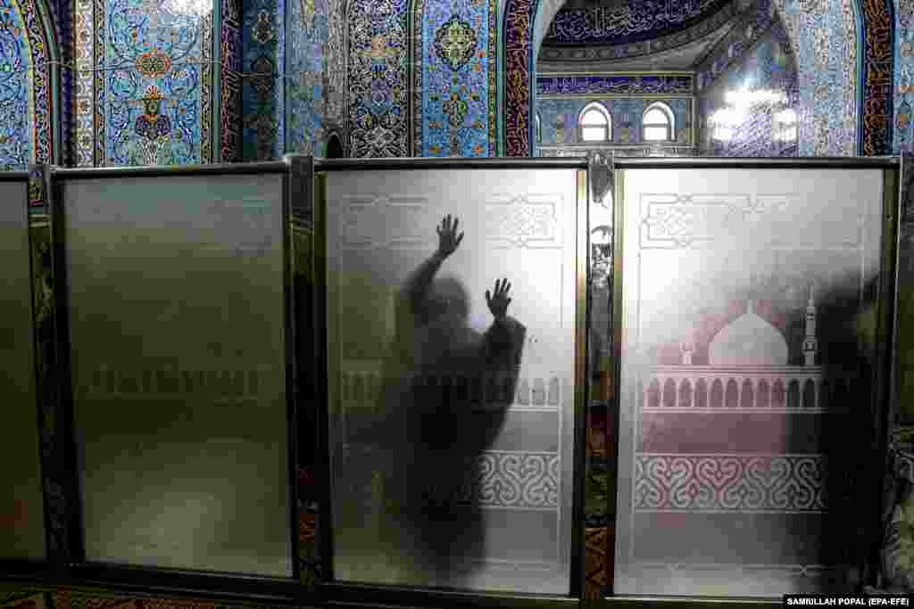 An Afghan worshipper visits the inside of the&nbsp;Sakhi Shah-e Mardan&nbsp;shrine. &nbsp;