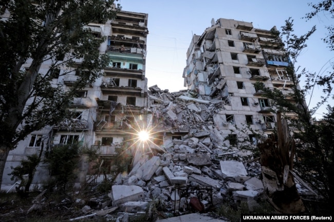 Heavily damaged residential buildings in the frontline town of Toretsk