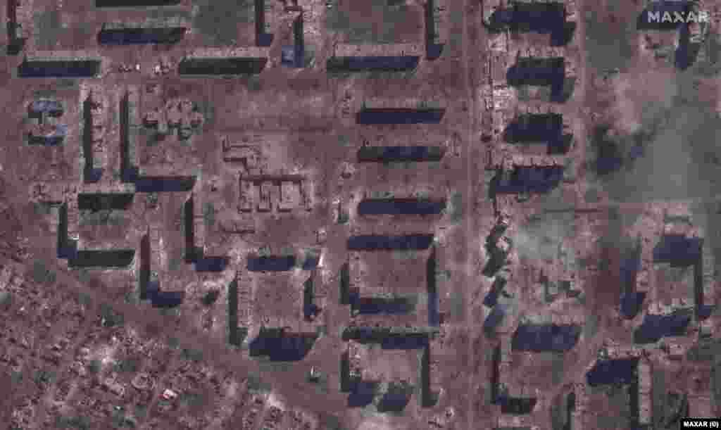 A demolished school and smoldering apartment buildings as seen on May 15, 2023. &quot;Across the city, rows of apartment buildings, schools, stores and other infrastructure have been reduced to smoldering rubble and parts of the city that had been lined with trees and parks a year ago are now completely stripped of all vegetation and are covered by brown/red dust and debris,&quot; says Maxar Technologies, which took these images.