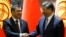Kyrgyz President Sadyr Japarov (left) and Chinese President Xi Jinping(file photo)
